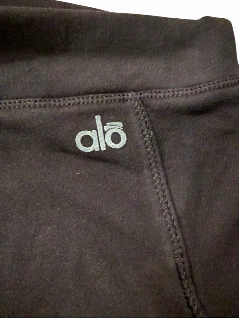 Alo Yoga XS black high-waisted flair leggings with elastic waistband